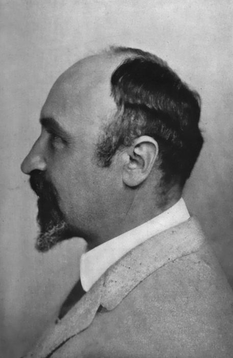 Profile photograph of Leo Baekeland, balding, with a dark beard and a light jacket