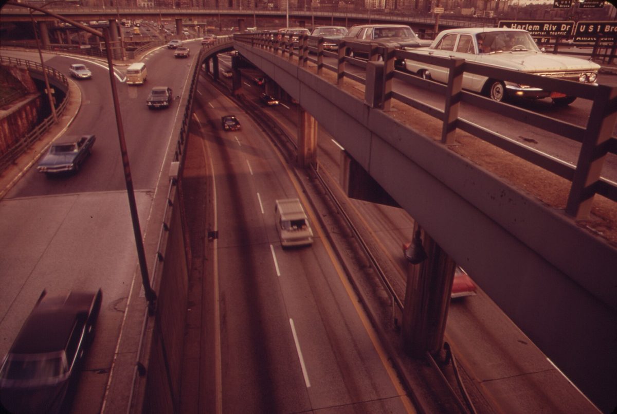 Traffic on the Cross Bronx Expressway in 1973, sunk below overpasses and ramps crowded with cars